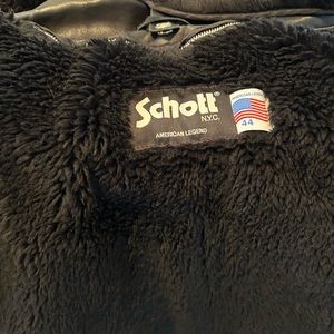 This is a custom black leather schott jacket in excellent condition